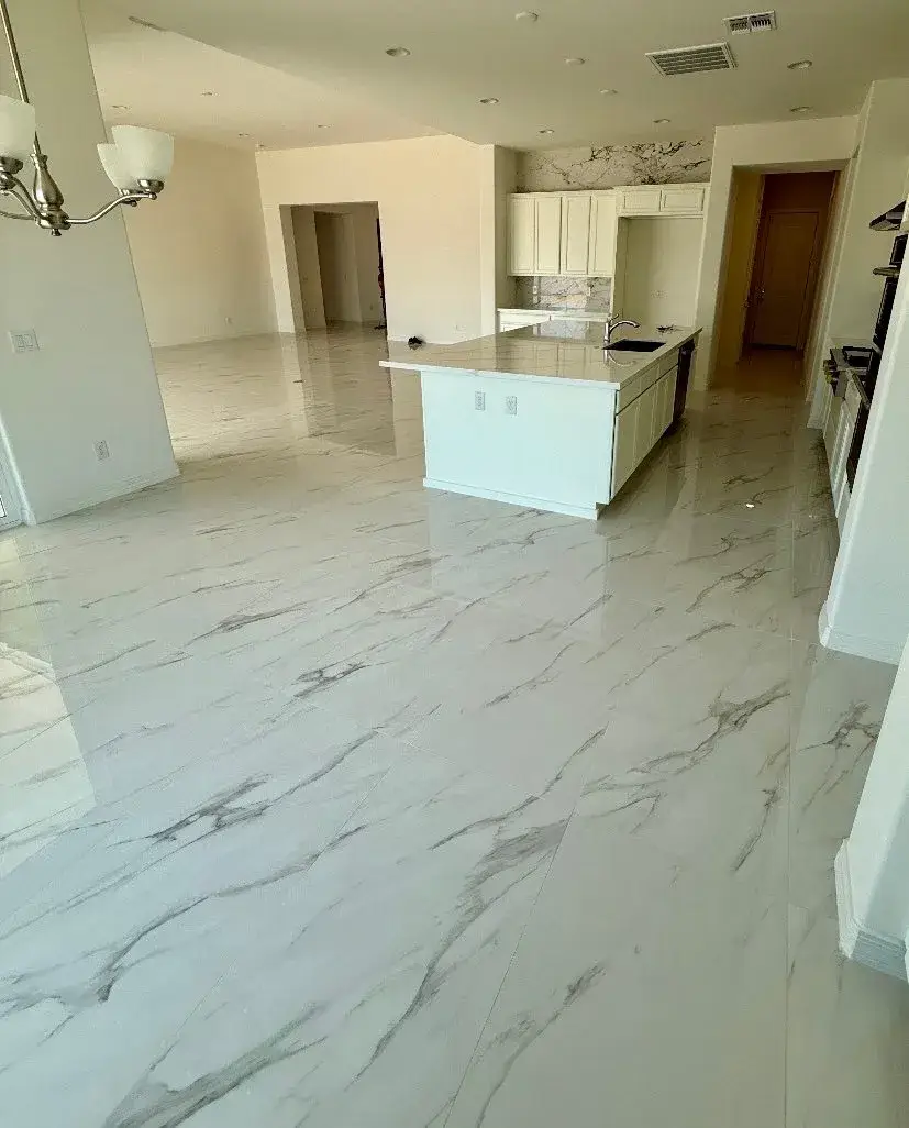 Open-concept Arizona kitchen with large-format marble-veined porcelain tile flooring installed by Zona Floors